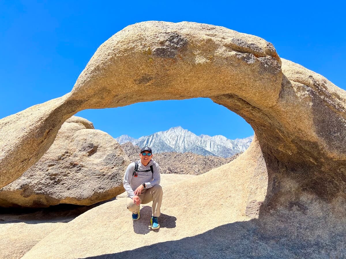 The iconic Mobius Arch with Lone Pine Peak in the background and the edges of Mount Whitney visible through the arch on the far right.