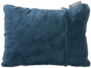 Therm-a-Rest Compressible Pillow, a 9 oz. camping pillow known for comfort despite its weight.