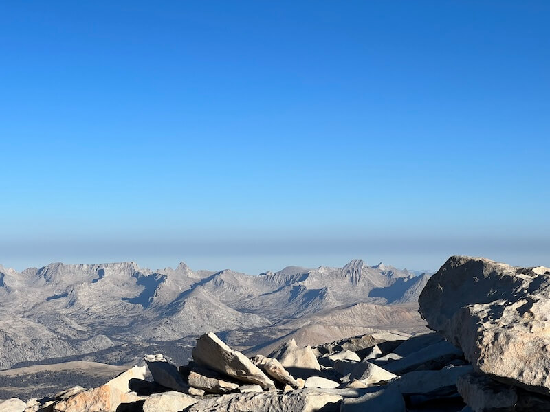 Granite summit blocks on the Mount Whitney summit plateau, just before the final right turn toward the summit. Reaching this point makes summiting feel inevitable.